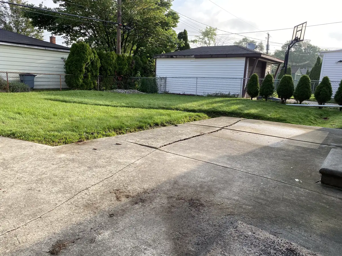 Completed drainage installation with gravel bed and landscape integration in Metro Detroit