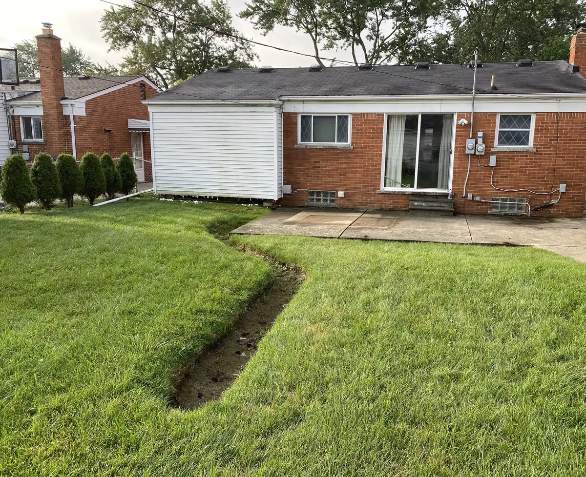 Residential property showing why professional drainage is essential in Michigan
