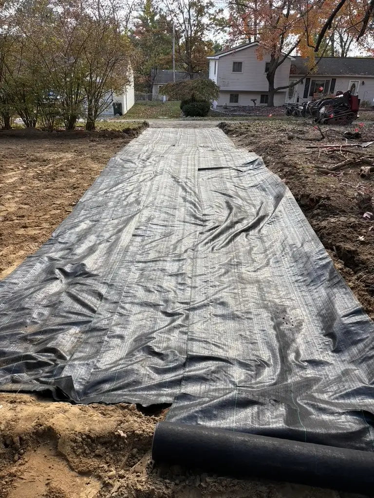 Catch basin installation with downspout routing to street in Warren