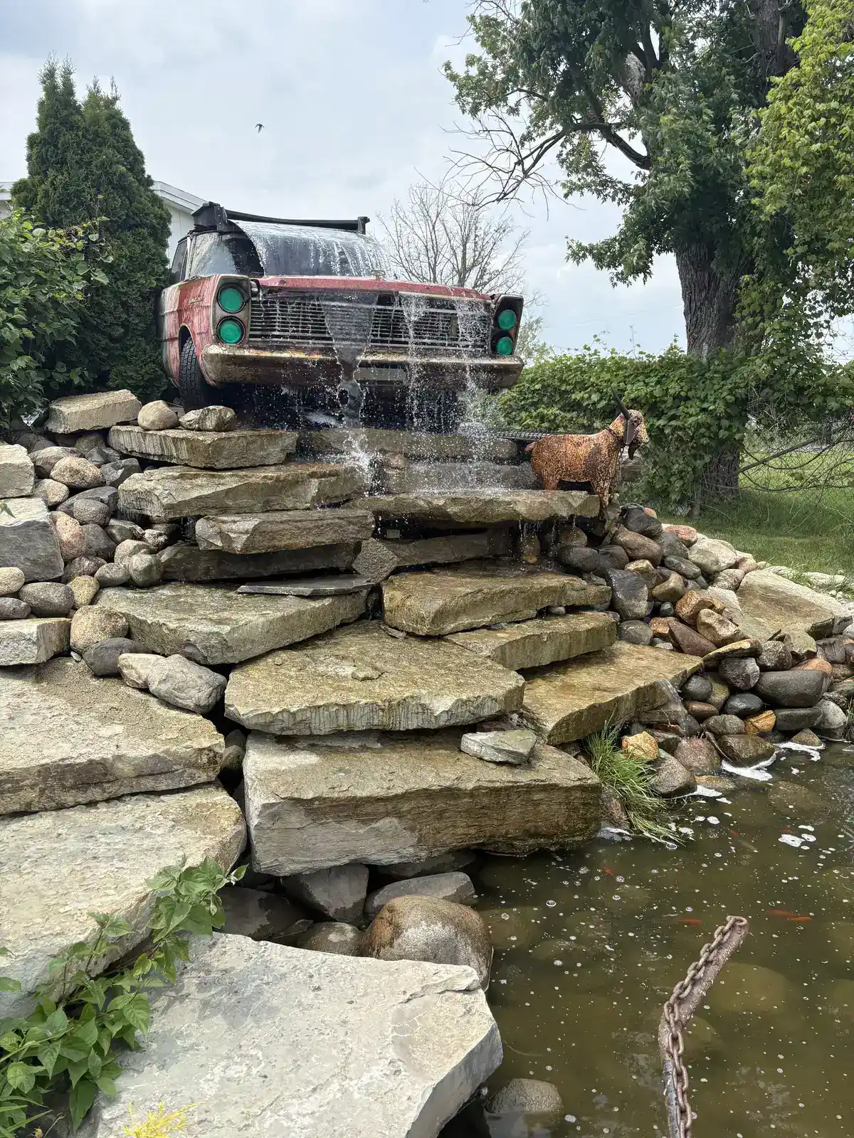 Dramatic view of custom vintage truck waterfall feature