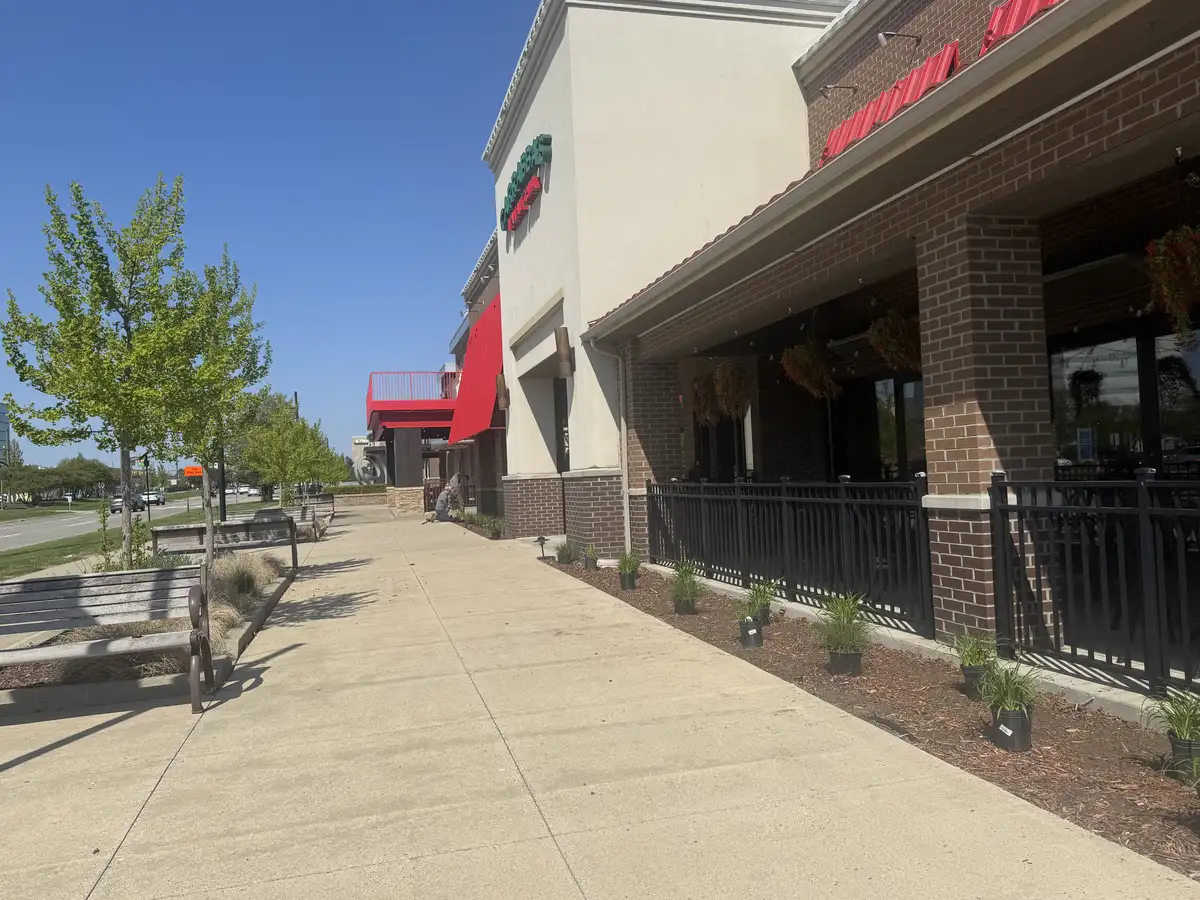 Residential landscaping in Warren, Michigan with fresh planting beds and lawn areas