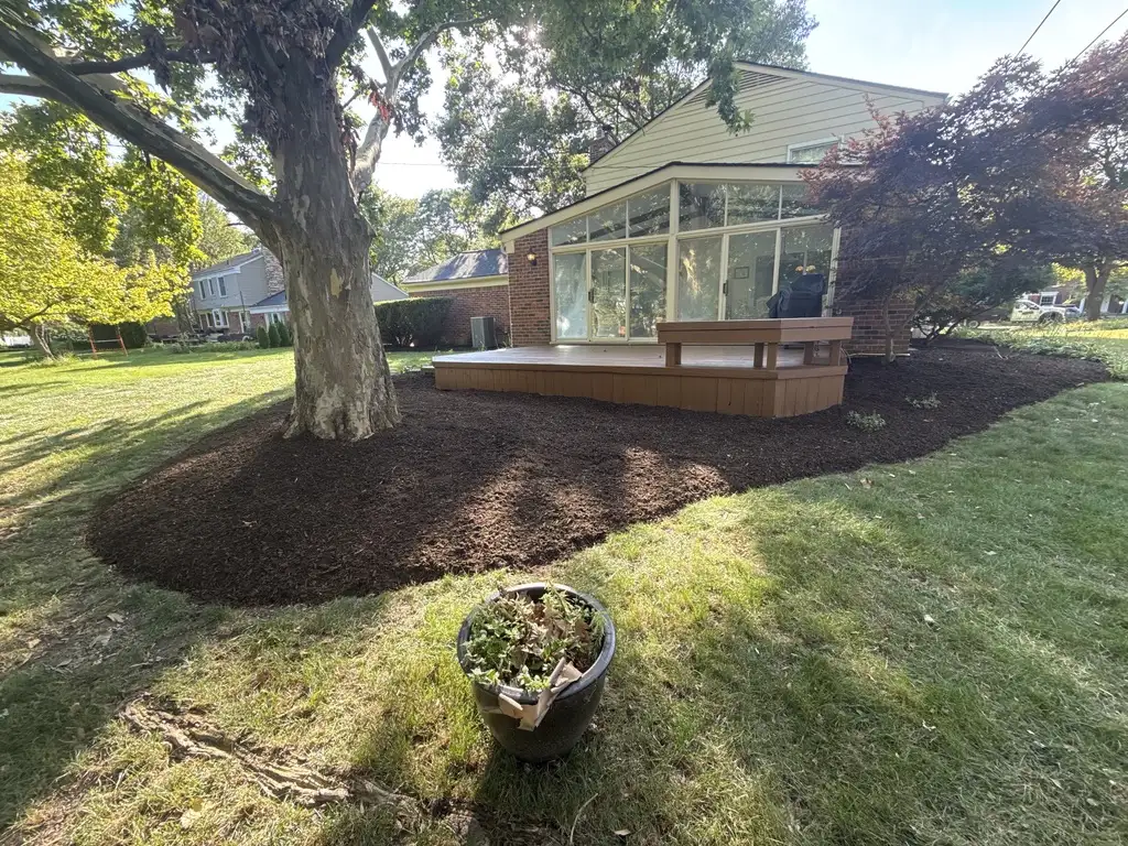 Fall yard maintenance with fresh mulch and manicured lawn
