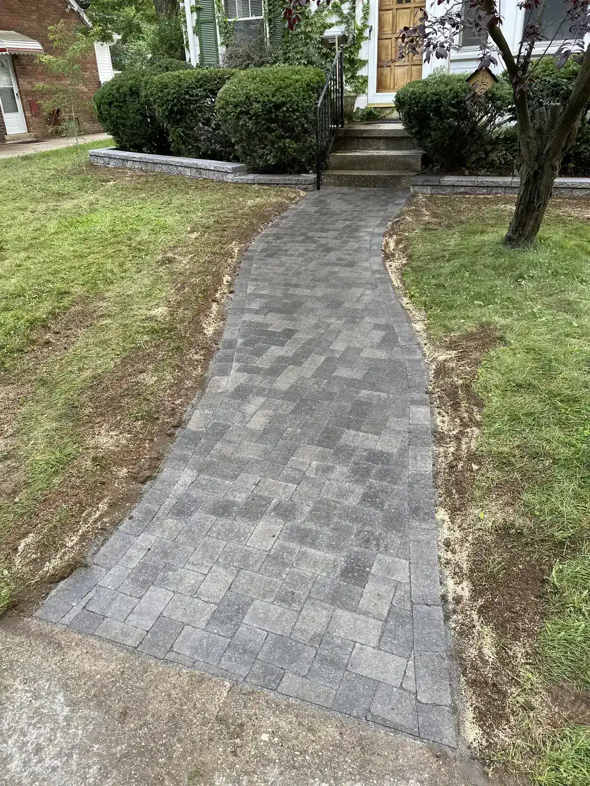 Precision paver patio installation by The Guy Outdoor Services