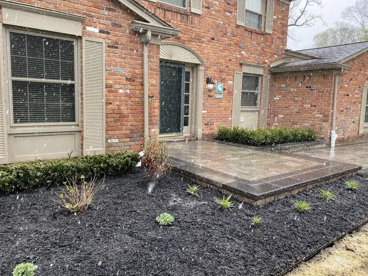 Custom patio with multi-level design and integrated landscaping