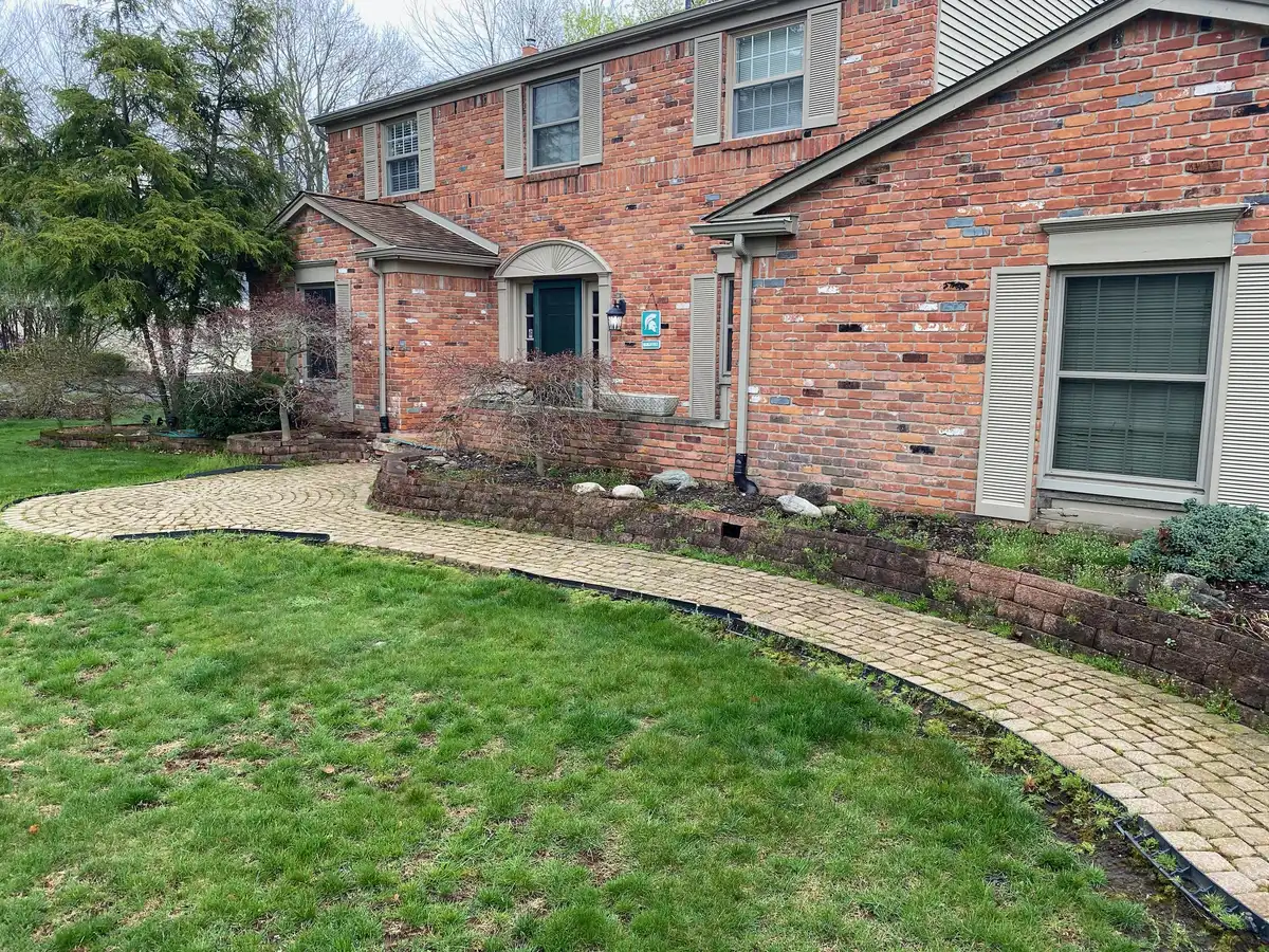 Luxury patio and landscape project in Birmingham, MI by The Guy Outdoor Services