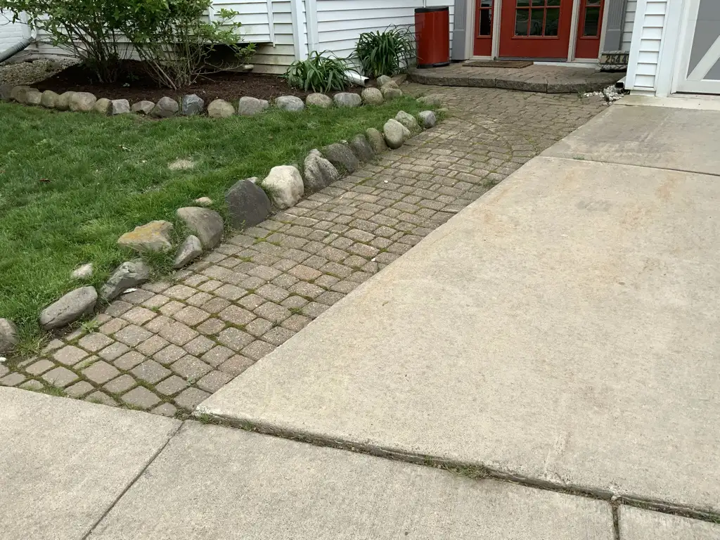 Front walkway with paver border and professional landscaping