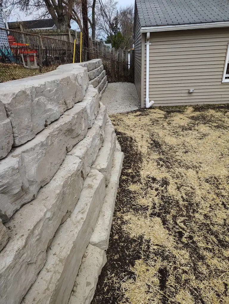 Completed Cole residence retaining wall with integrated landscaping