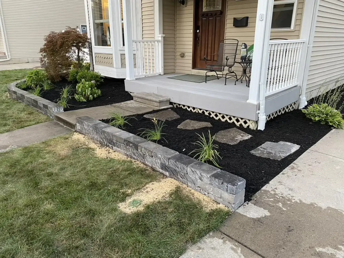 Robert Adams retaining wall with landscape and porch integration in Metro Detroit