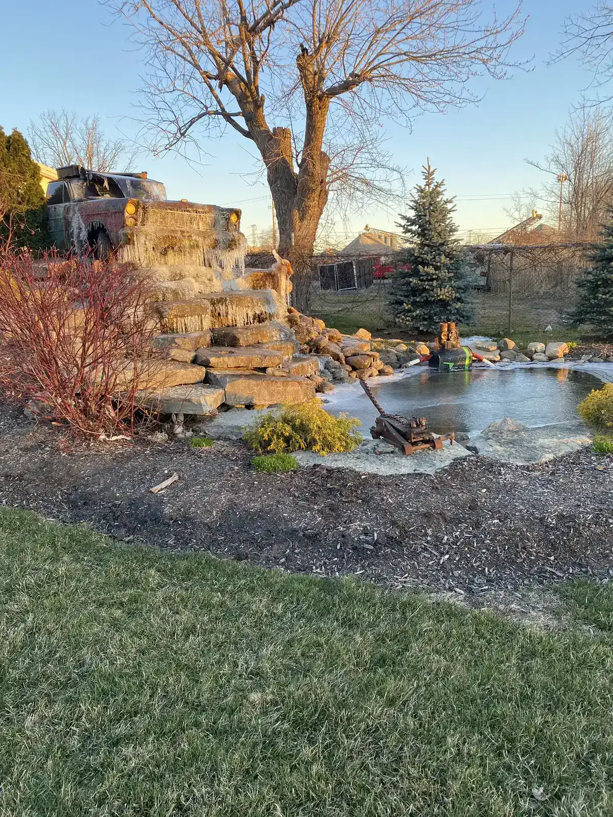 Custom pond and waterfall requiring seasonal maintenance in Metro Detroit