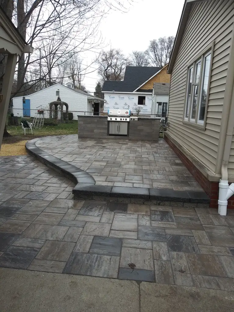 Custom pond with natural stone edging built by The Guy Outdoor Services in Metro Detroit